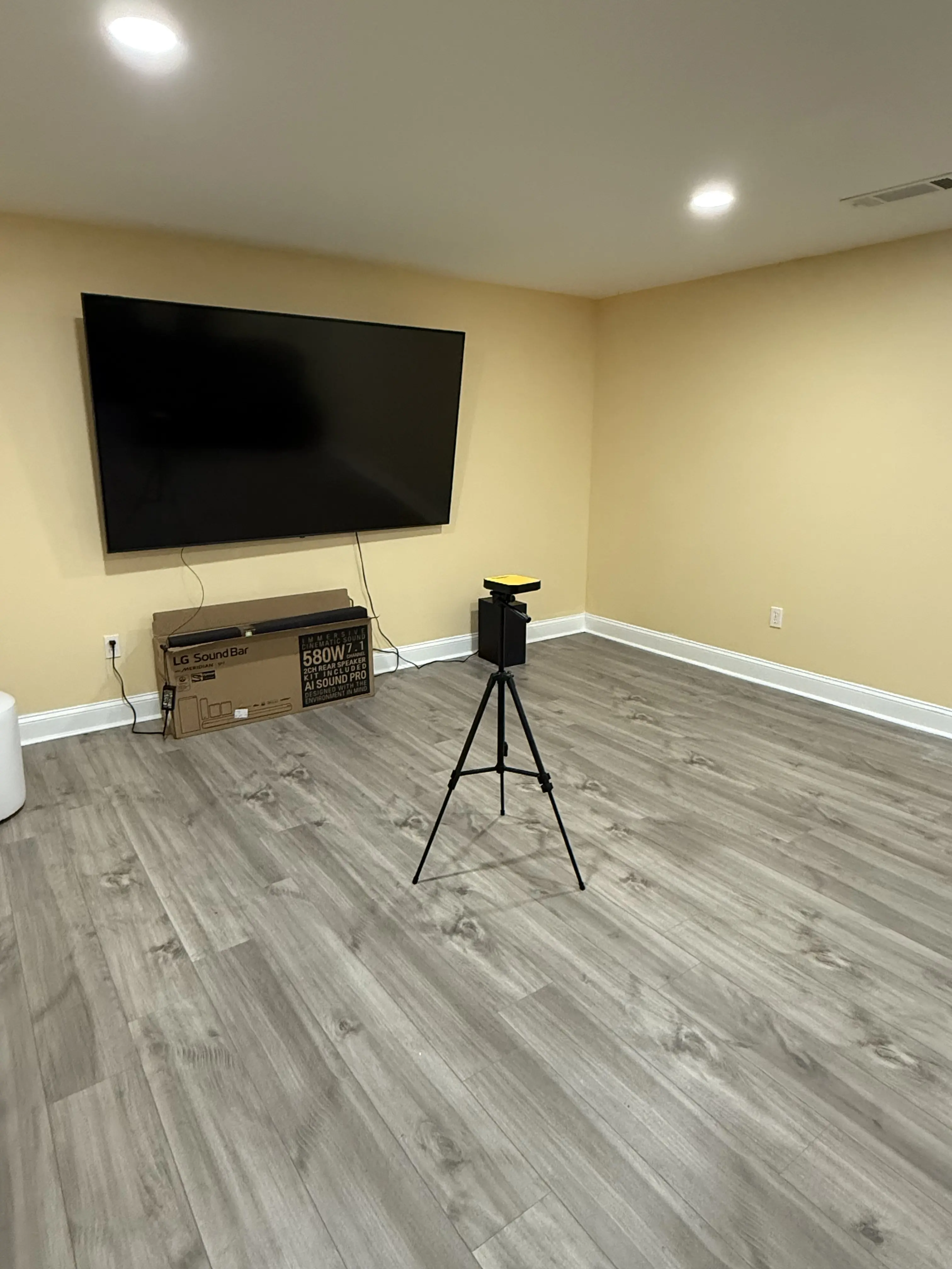 two men testing for radon inside a home using advanced radon testing equipment